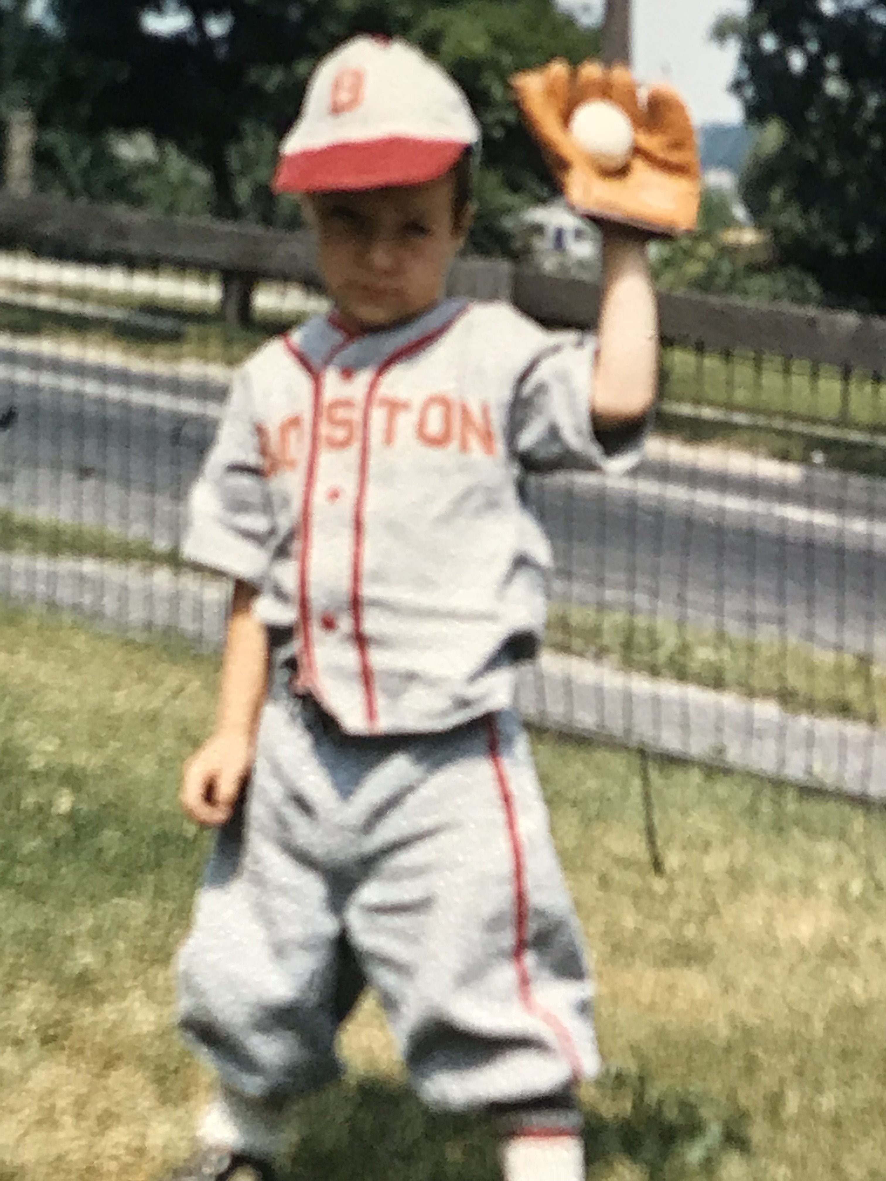 Dan playing baseball as a child